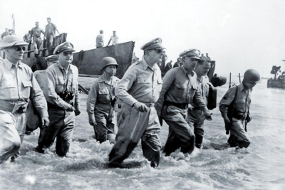 General Douglas MacArthur wades ashore during initial landings at Leyte, Philippine Islands - 20 October 1944